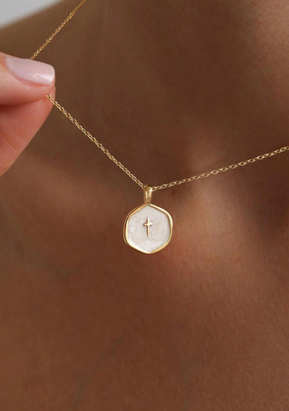 Petite enamel cross necklace in gold, shown close up
