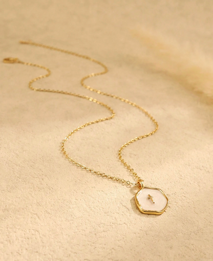 Petite enamel cross necklace in gold, shown close up — view 15