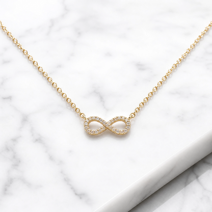 Delicate infinity pendant necklace in gold