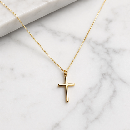 Simple cross pendant necklace on a fine chain