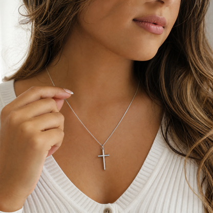 Simple cross pendant necklace on a fine chain — view 4
